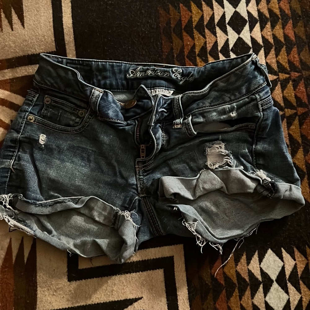 Distress mid rise jean shorts